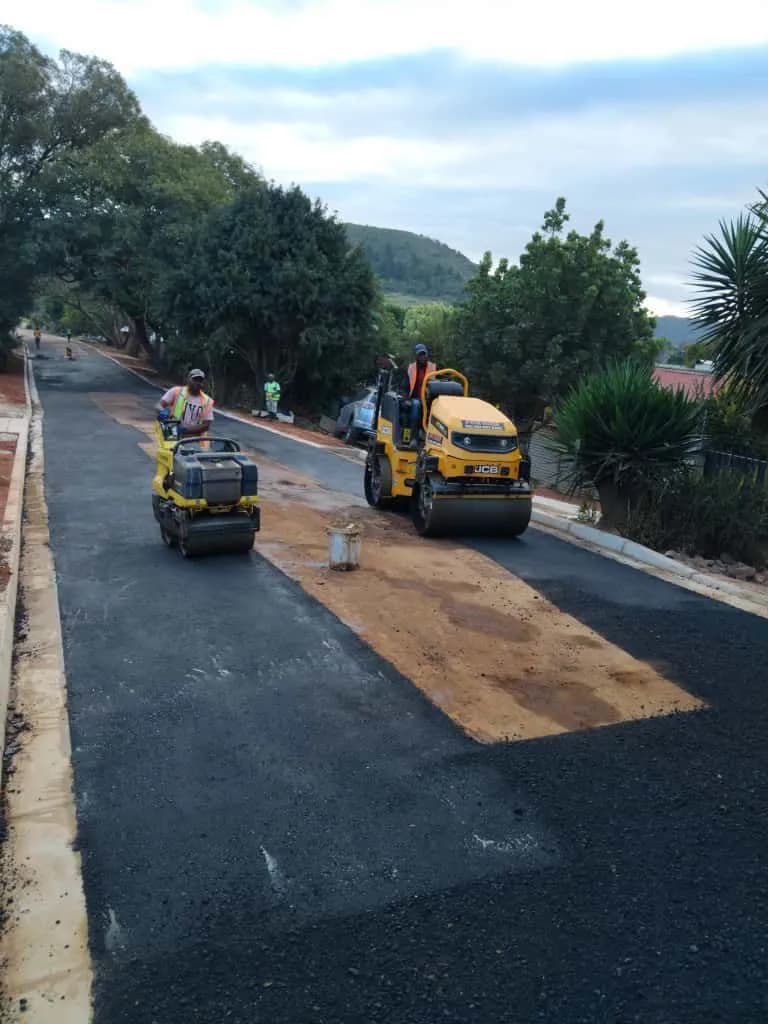 Roller compacting a new asphalt surface