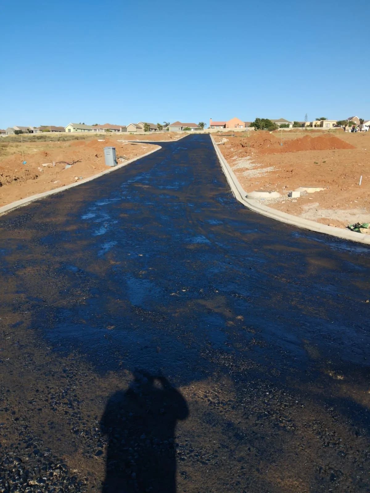 New residential street being surfaced with asphalt