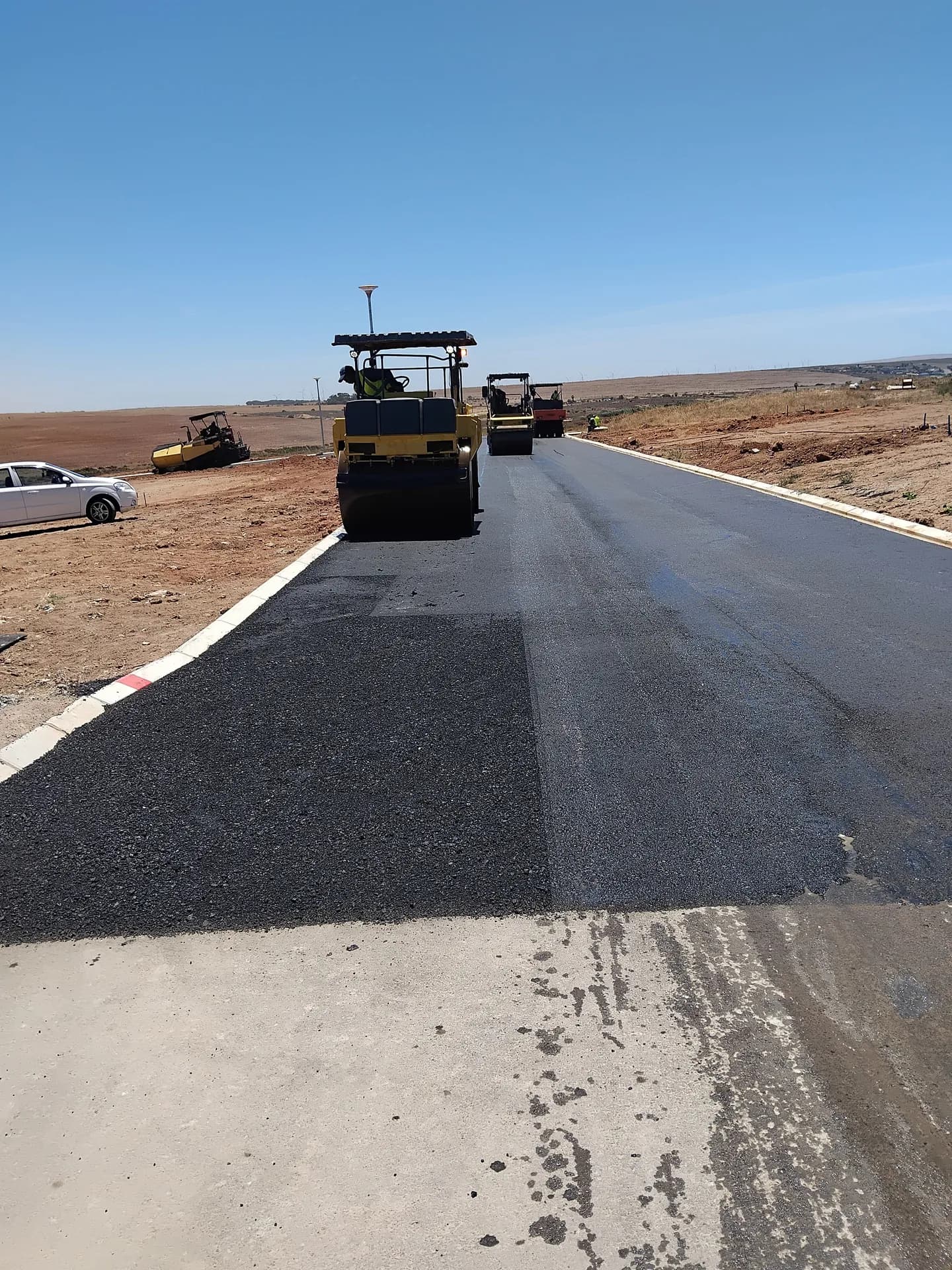 Roller finishing the second lane of a new road