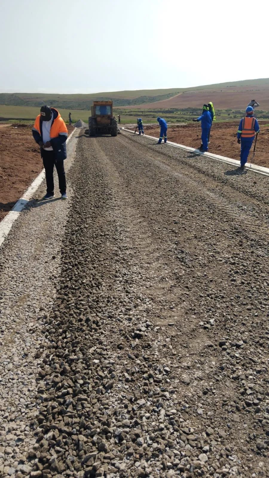 Stone base layer being prepared and graded